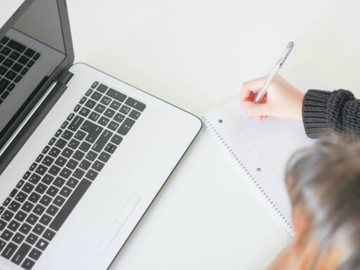 woman writing on notebook